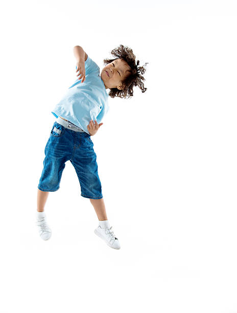 istock Little boy jumping isolated on white background 614844742