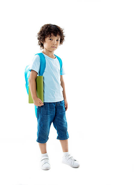 little asian boy with a book against white background - little boys preschooler back to school backpack imagens e fotografias de stock