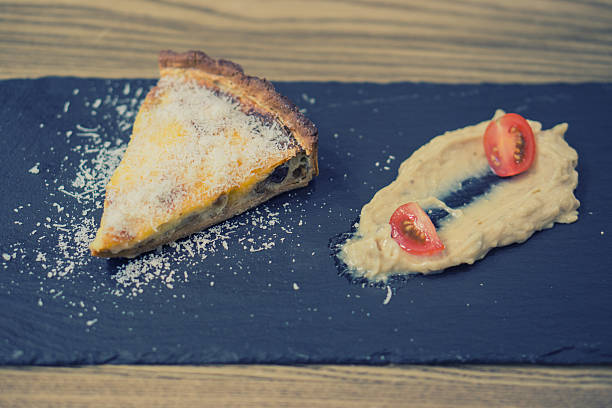 piece of tart pie sauce tomato black slate plate - nodoby imagens e fotografias de stock