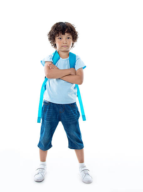 istock Little asian boy with schoolbag against white background 614848550