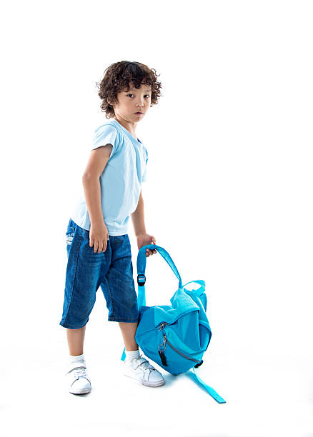 istock Little asian boy with schoolbag against white background 614848888