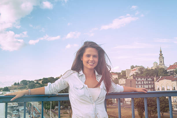 istock Smiley girl posing in front of the camera. 614849108