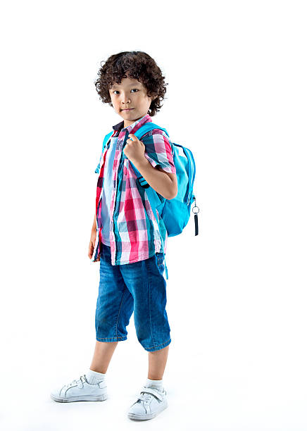 istock Little asian boy with schoolbag against white background 614849368