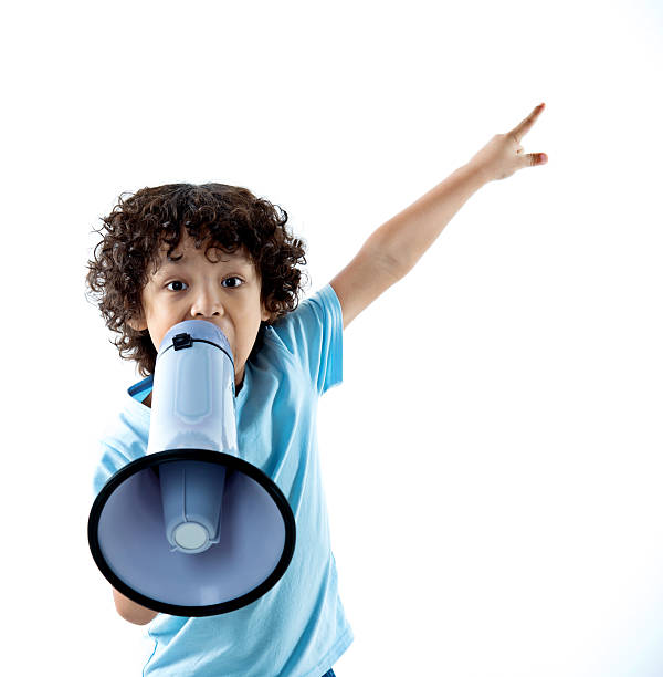 Little boy with megaphone on white background Little boy with megaphone on white background only boys stock pictures, royalty-free photos & images