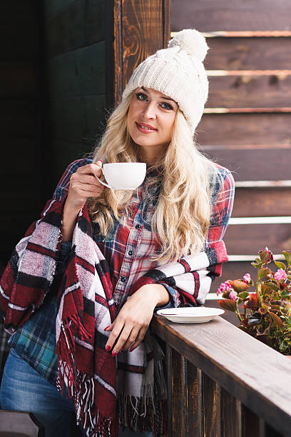 istock Young attractive woman with a cup of coffee 614849738