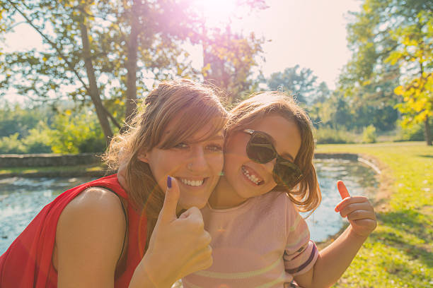 istock Mother and daughter enjoying in the park. 614850736