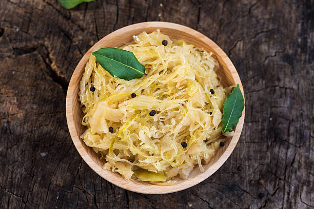 istock Steamed sauerkraut on old wooden background 614850822