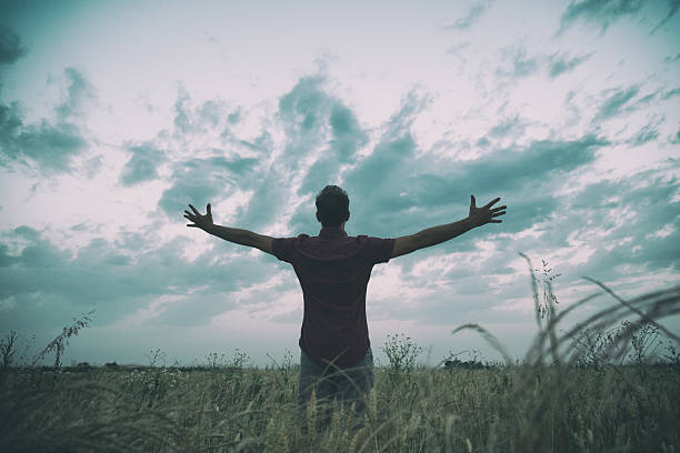istock Man enjoying in nature. Wheat field. 614851296