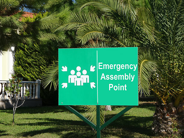 Assembly point Emergency assembly point green sign acute angle stock pictures, royalty-free photos & images