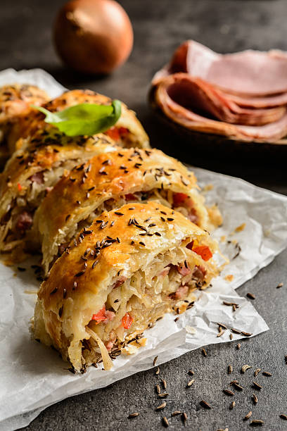 istock Savory strudel with sour cabbage, bacon and onion 614857070
