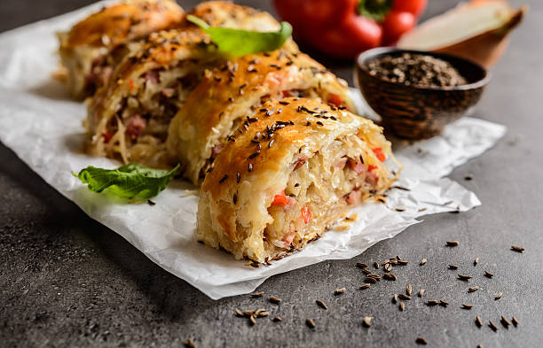 istock Savory strudel with sour cabbage, bacon and onion 614857212