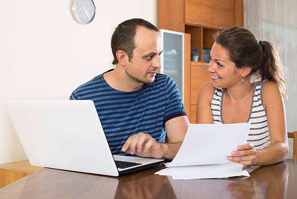 istock Insurance agent helping client to choose the product 614858852