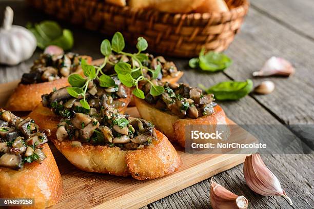 Fried Baguette With Mushrooms Garlic And Herbs Stock Photo - Download Image Now - Edible Mushroom, Bruschetta, Bread