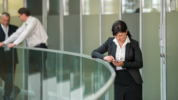 istock Businesswoman With Smart Phone 614859556