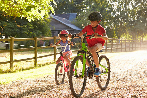 istock Two Children On Cycle Ride Together 614859928