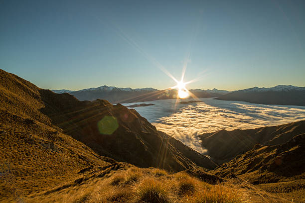 istock Sunset above the clouds, view from mountain top 614860374