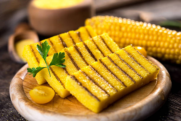 istock Grilled polenta on old wooden background 614861706