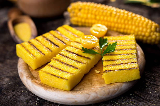 istock Grilled polenta on old wooden background 614861858