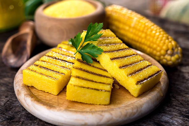 istock Grilled polenta on old wooden background 614862330