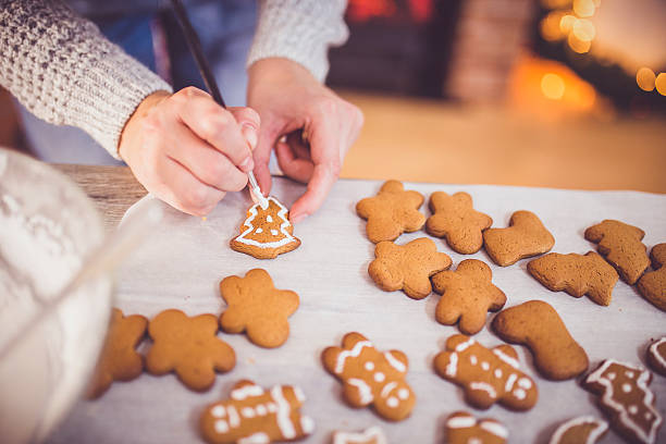 istock woman making gingerbread and cookies 614863274