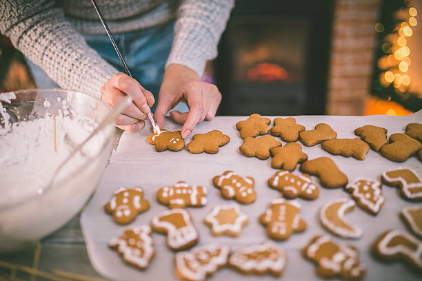 istock woman making gingerbread and cookies 614863530