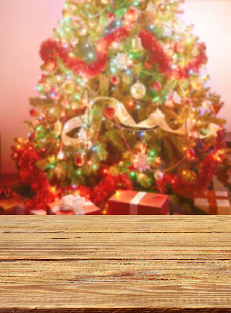 istock Defocused Christmas Tree and wooden background 614867522
