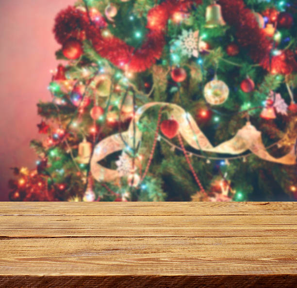 istock Defocused Christmas Tree and wooden background 614867828