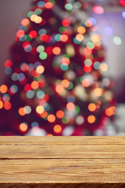 istock Defocused Christmas Tree and wooden background 614868480