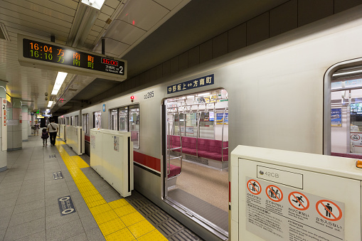 Tokyo, Japan - August 13, 2016 : People at the Nakano-sakaue Station. The Tokyo Metro Marunouchi Line train in Tokyo, Japan. This train is going to Honancho Station from Nakano-sakaue Station.