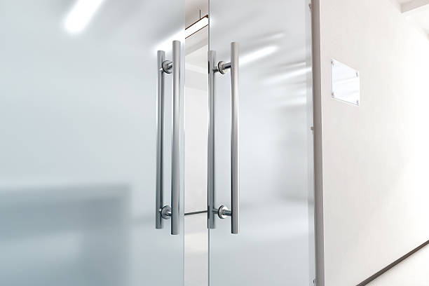 istock Blank glass door with metal handles mock up, 614869082
