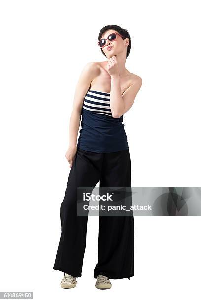 Young Flirty Short Hair Beauty With Sunglasses Blowing A Kiss Stock Photo - Download Image Now