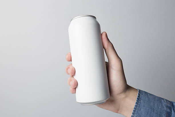 Blank Can in hand on white background stock photo