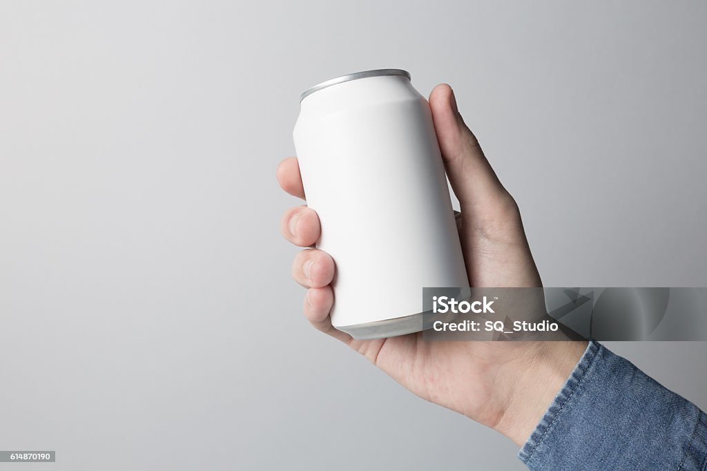 Blank Can in hand on white background Blank Can in hand on white background, redy for replace your design. Can Stock Photo