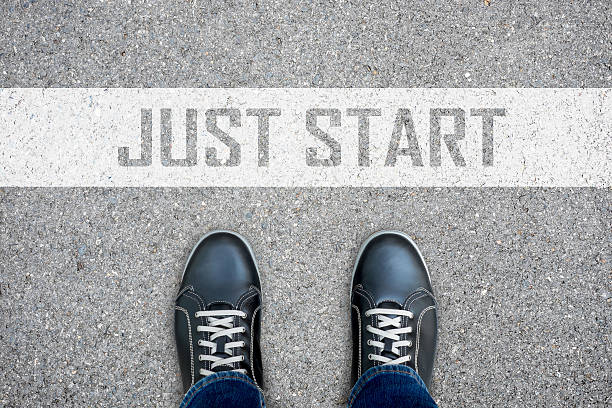 Black casual shoes standing at just start line.