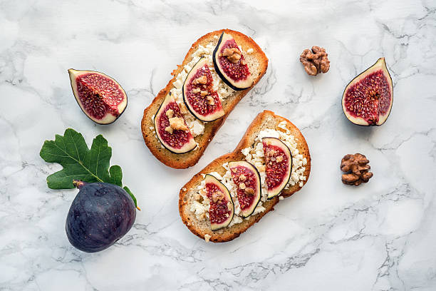 Figs toast on marble. Top view. stock photo