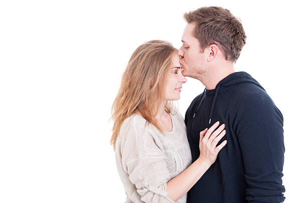 istock Man kissing on forehead her beautiful lady 614871928