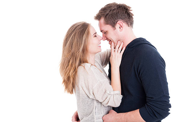 istock Attractive couple being affective and looking happy 614872036
