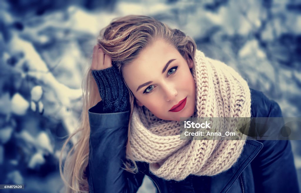 Gorgeous woman portrait Closeup portrait of beautiful woman with red sexy lipstick posing in the winter park, gorgeous makeup, stylish look, wintertime fashion Winter Stock Photo
