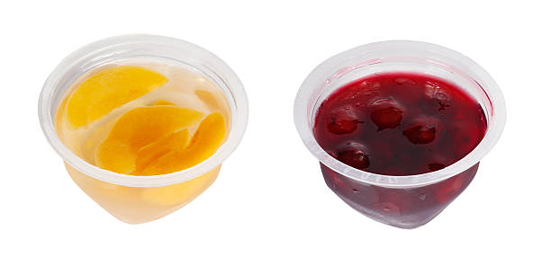 istock Peach and cherry jam in plastic jars 614872710