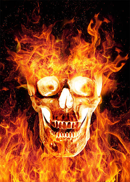 istock Flaming scaring skull isolated on black background 614872786