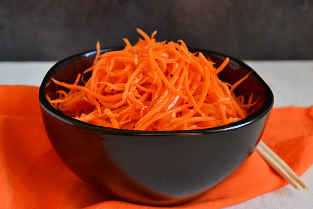 istock marinated, spicy carrots with spices, oriental cuisine 614873366