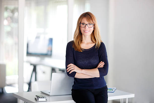 istock Attractive professional woman at office 614873634