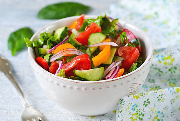 istock Vegetable salad with spinach, tomato and cucumber 614874716