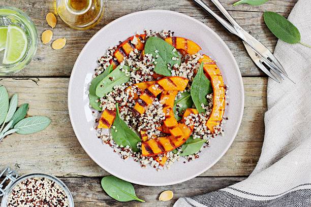 istock Quinoa salad with  pumpkin and  spinach 614874804