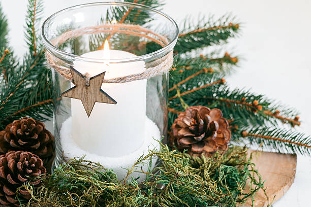 istock Christmas candle with natural ornaments 614875882