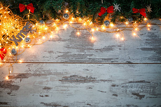 istock Christmas wooden background with fir branches 614877740