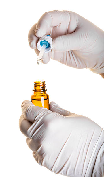 istock hand with bottle of medicine 614877868