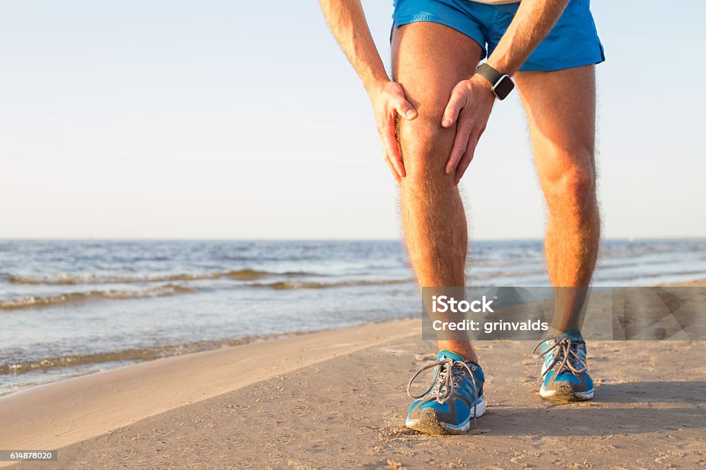 Man having a pain in his knee Anterior Cruciate Ligament Stock Photo