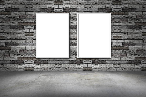istock white frame on a brick wall and the concrete floor 614879922