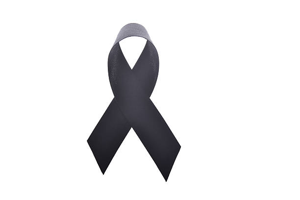 istock Black ribbon,melanoma awareness or symbol mourning isolate on white 614952118